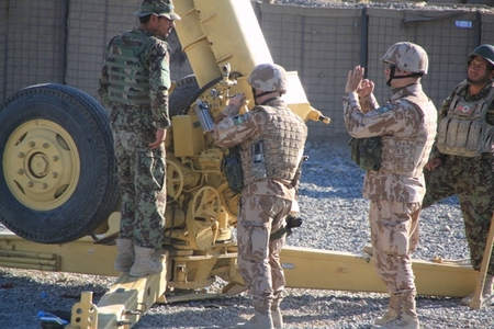 Before live fires of Afghan artillery crew with 122 mm D-30 gun assisted by Czech instructors (Dec 2012, Logar, Afghanistan)