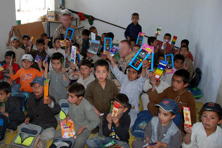Distribution of teaching aids from the Centipede during a recent Czech PRT project in Logar, Afghanistan