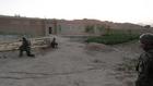 Afghan soldiers secure the scene of the search operation