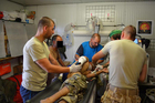 Medics cooperate in saving life of a soldier