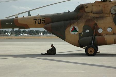 An Afghan pilot with his machine