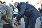 Minister Picek awards Athos with a new collar