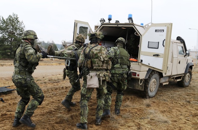 Evacuation of "wounded" soldiers by an armoured Iveco ambulance