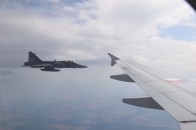 Military aircraft carrying remains of soldiers was accompanied by a pair of Gripen fighters