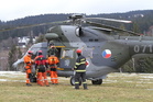 W-3A Sokol with military and civilian rescue personnel