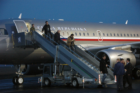 Defence Minister Alexandr Vondra welcomes passengers of the first flight shortly before 6 a.m.