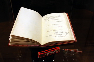 Display of a 1920s Constitution Act with ceremonial pen