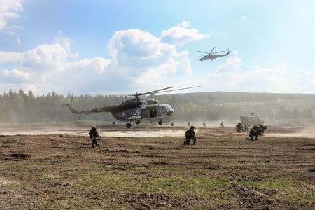 Soldiers of 4th Brigade train the taking of perimeter defence round the helipad