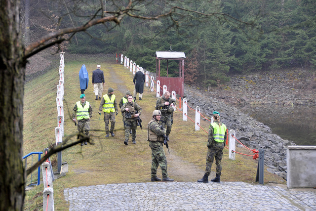 Soldiers' activities are evaluated by a staff of referees (in yellow vests)