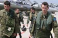 Pilots leave an aircraft stand