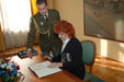 Mrs. Vlasta Parkanova signs the document